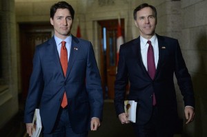 Minister of Finance Bill Morneau is accompanied by Prime Minister Justin Trudeau as he makes his way to deliver the federal budget in the House of Commons on Parliament Hill in Ottawa on Tuesday, March 22, 2016 (Sean Kilpatrick/CP)